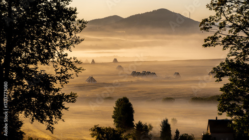 A rural village in morning mist in the mountains