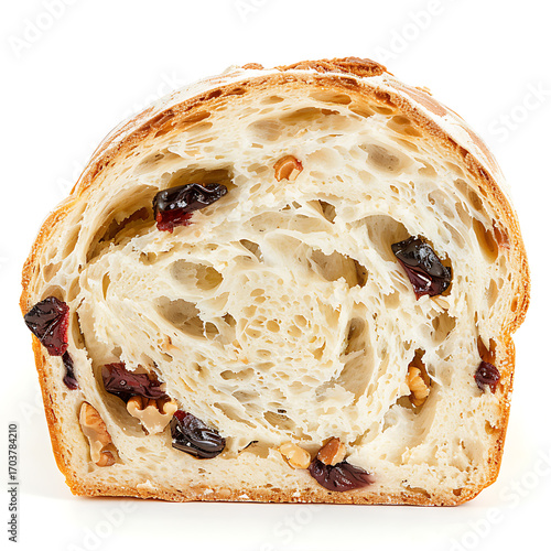 Slice of artisan bread with raisins and walnuts, showcasing airy crumb and golden crust