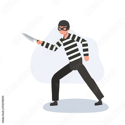 a burglar wearing striped clothes and mask holding a knife portraying a crime situation