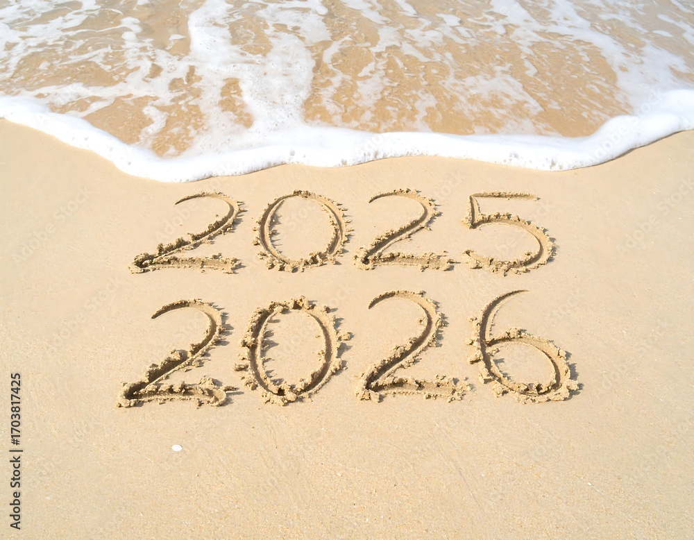 Fototapeta premium Sand-drawn 2025, 2026 on beach, waves