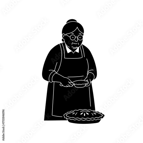 Elderly woman cooking pie in apron while smiling in the kitchen concept of Thanksgiving  