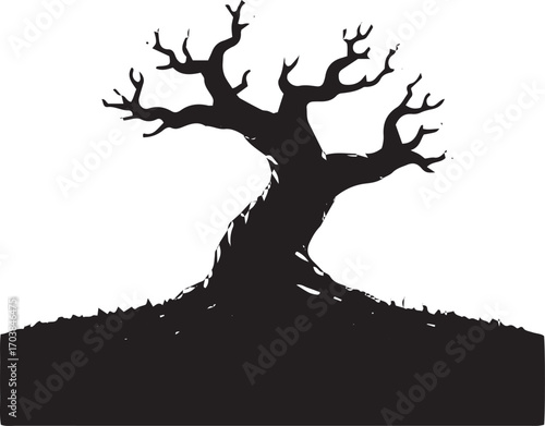 Eerie bare tree silhouette against symbolizing autumn or winter season