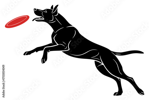 Athletic black dog leaping to catch a red frisbee