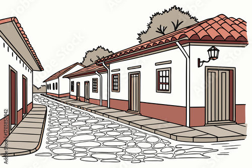 Charming cobblestone street lined with traditional houses and red tile roofs
