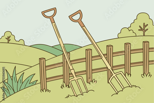 Two pitchforks stuck in the soil by a wooden fence
