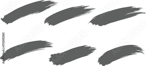 Collection of six grunge brush strokes in shades of grey and white