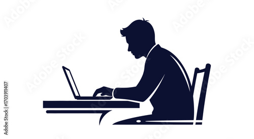Silhouette of a person working on a laptop at a desk