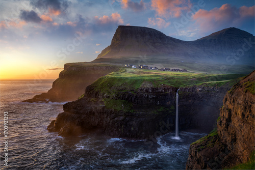 Múlafossur Waterfall during sunset with Gasadalur in frame