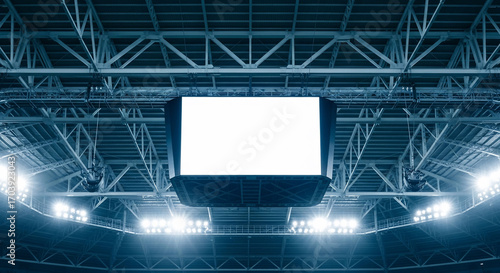 Stadium scoreboard with blank white screen and bright arena lights