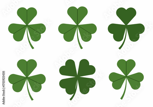 Collection of green clover leaves, including shamrocks and a lucky four-leaf clover, isolated on white background.