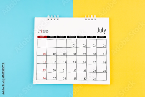 Wallpaper Mural July 2026 calendar on blue and yellow color background, Flat lay. Torontodigital.ca