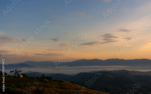 Traval at camping at the top of the mountain, the sunshine at dawn shines on the beautiful mountain scenery and the scenery of Thailand.
