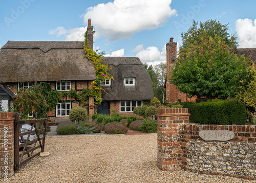 Traditional English village with thatched cottages.