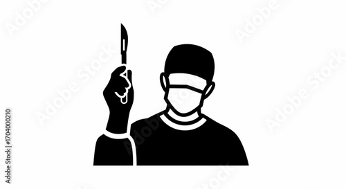 Surgeon holding scalpel ready for surgery