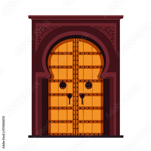 Ornate Moroccan studded wooden double door with a traditional keyhole arch and carved frame.