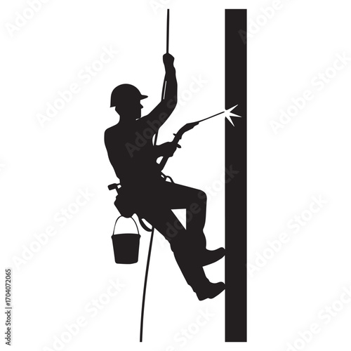 Silhouette of a professional cleaner rappelling down a building facade while pressure washing a vertical surface with specialized equipment