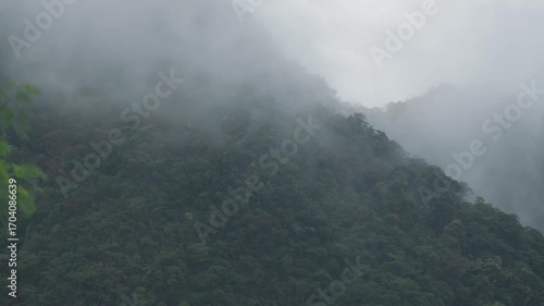 Sunrise view with mist over mountains and forest at Din Daeng Doi, Krabi, Thailand, creating a serene and dramatic natural landscape.