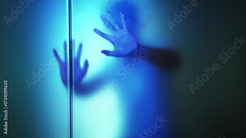 Silhouette of men behind frosted glass, slow motion video