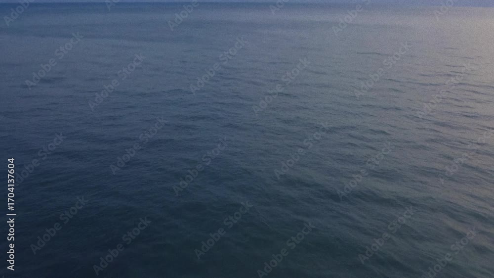 Calm Ocean Surface Under Soft Evening Light