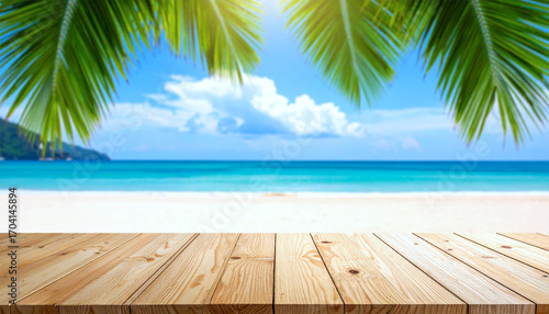 Empty wooden table over blue sea, beach and palm leaves background on summer day. Space for product display.