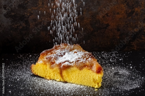 Tasty homemade apple pie with golden crust and sweet filling. Sprinkle powdered sugar on top.
