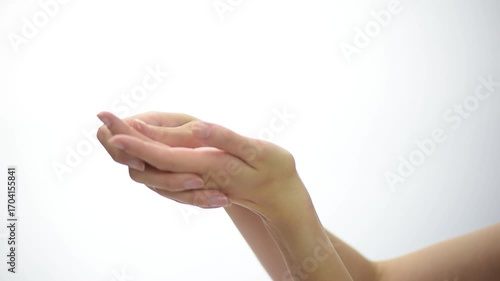 Nail care and moisturizing routine for beautiful hands and healthy nails demonstrated by a woman