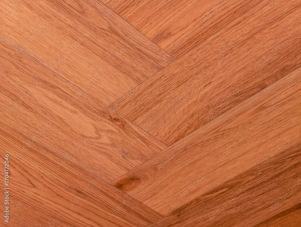 Fototapeta premium Brown Wood Flooring Texture - Elegant Herringbone Pattern for Modern Interior Design, Promotional Material, and Creative Marketing Projects
