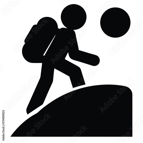 Silhouette of a hiker with backpack climbing a hill near the sun
