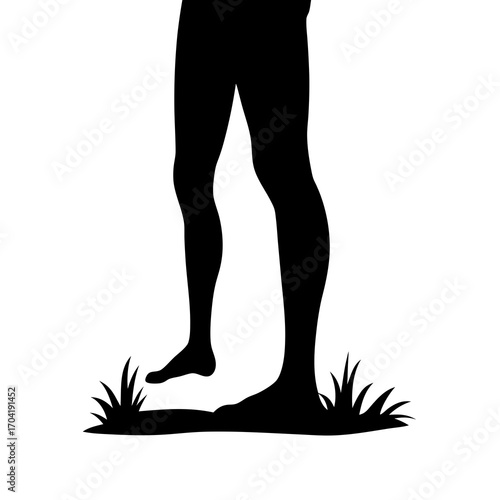 Silhouette of legs walking on grass, a tranquil and evocative representation