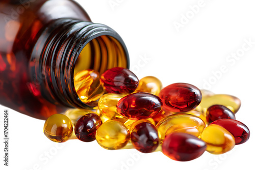 Close up of  supplements spilling from a bottle.