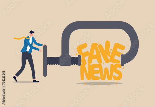Stop fake news and misinformation spreading on internet and media concept, businessman leader squeezing and destroy the word fake news.