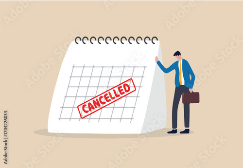 Business trip cancelled, marketing event, plan to launch new product postpone or cancelled due to COVID-19 Coronavirus pandemic concept, sad businessman standing with calendar with red Cancelled stamp