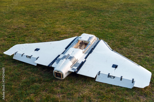 Crashed Russian Gerbera UAV decoy drone lying on the ground. False aerial target used to overload air defense systems, damaged and destroyed unmanned aircraft wreckage.