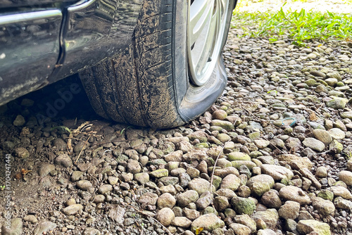completely flat tire on a car, road breakdown, accident