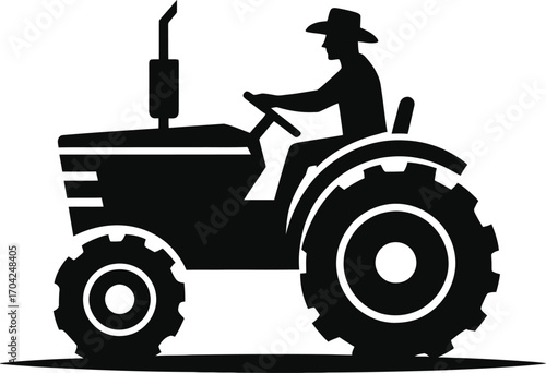 Black and White Silhouette of a Farmer Driving a Tractor in the Field