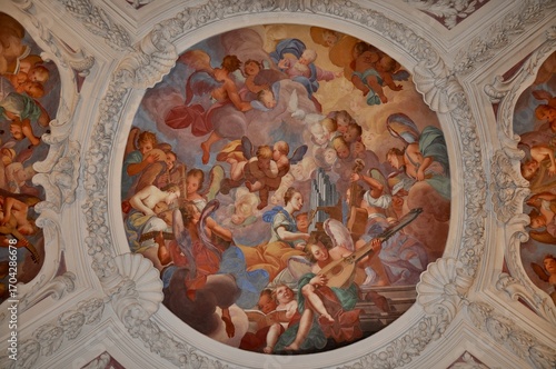Details Of The Magnificent Interior Of St. Stephan's Cathedral In Passau, Germany.The vaulted ceilings are adorned with intricate stucco work, including figures of atlases, prophets, and cherubs