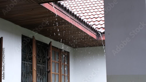 Wallpaper Mural A house with a roof that is leaking. The rain is falling on the roof and the gutters Torontodigital.ca
