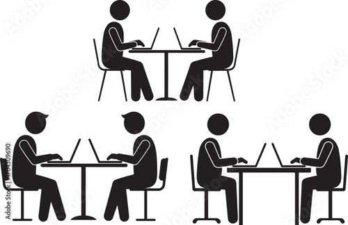 People working on laptops together silhouette