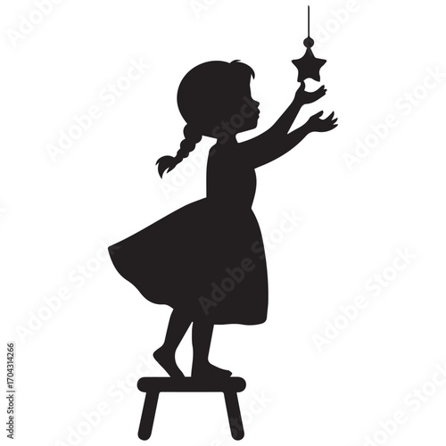 Silhouette of a young girl reaching for a star on a stool