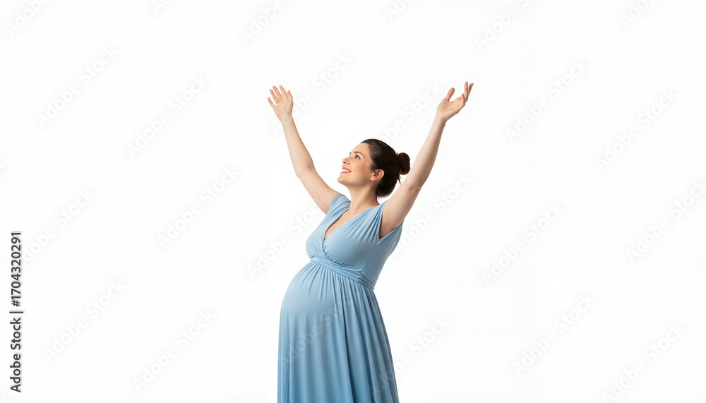 Obraz premium Pregnant woman with arms raised expressing joy against white background 