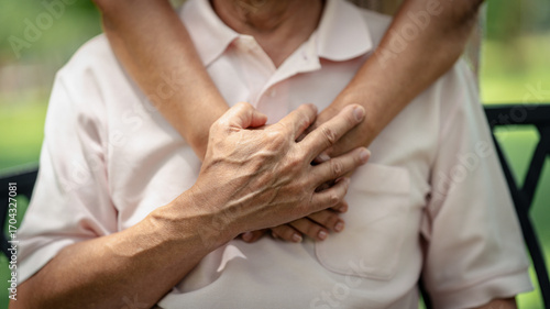 Photos Elderly hands share a tender embrace and support encouraging old people symboliz