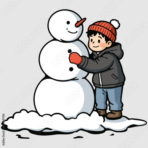 Smiling boy with joyful spirit building a snowman