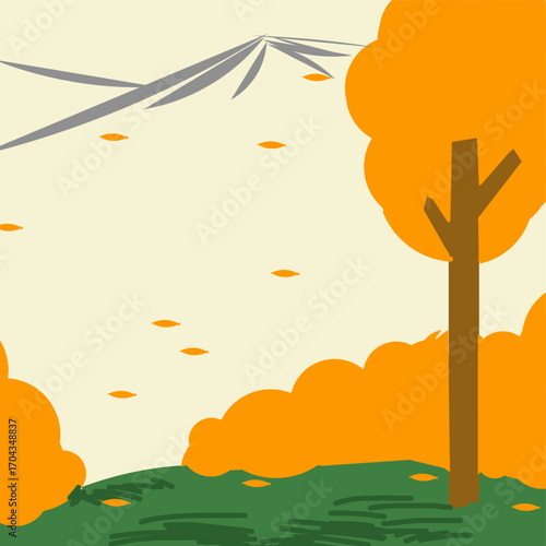 Trees and shrubs with yellow leaves on green grass with a mountain view in the distance in autumn