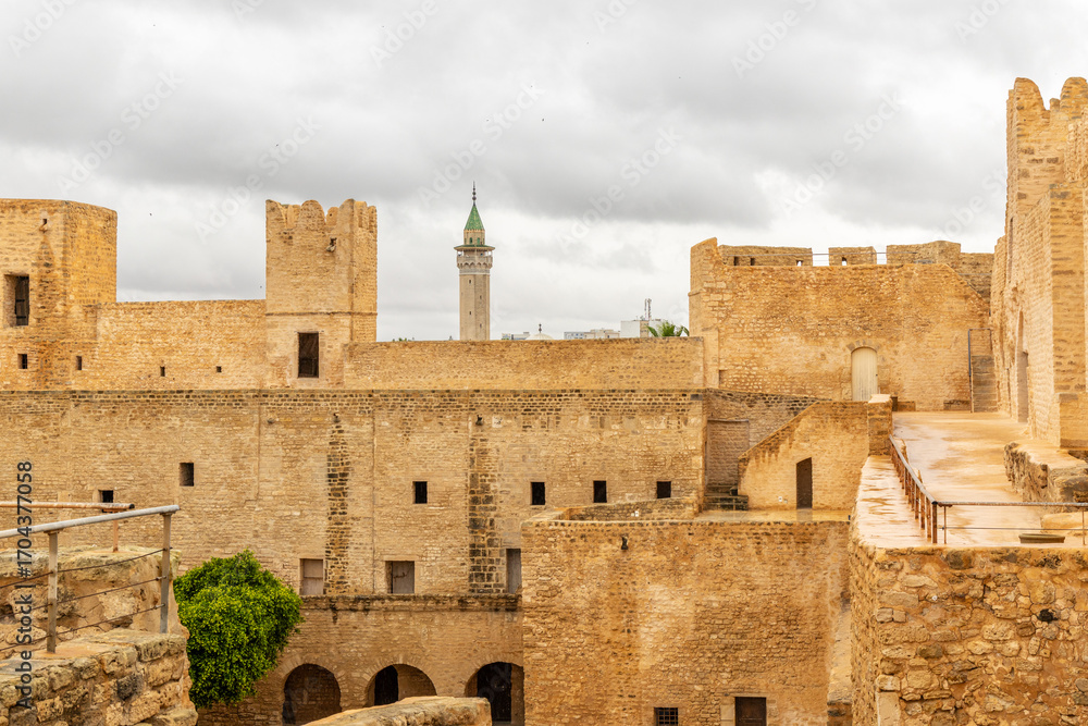 Naklejka premium Inner yards and walls of Ribat of Monastir under cloudy skies, Monastir, Monastir Governorate, Tunisia