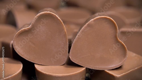 Heart-shaped chocolate candy. Delicious gifts for Valentines Day. Sweetness, pleasure and love