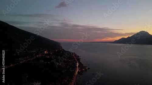 Aerial Sunset Over Lake Garda: Drone Flight from Porto di Brenzone, Brenzone sul Garda, Italy