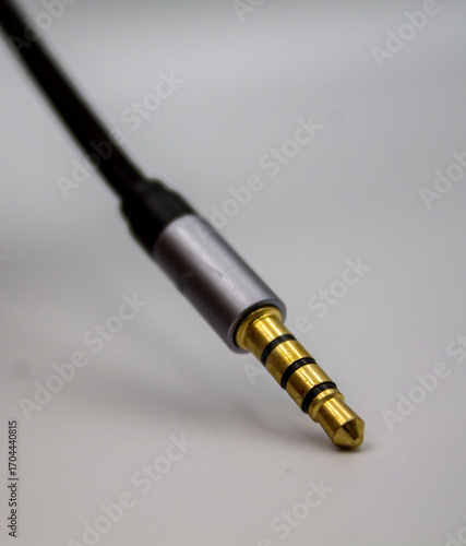Mini jack audio connector tilted on white background vertically
