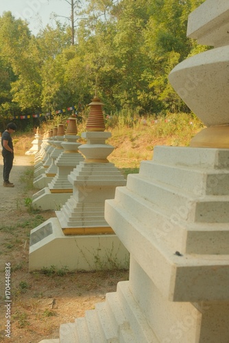 Buddhist Stupa with Prayer Flags and Golden Spire, Low-Angle View