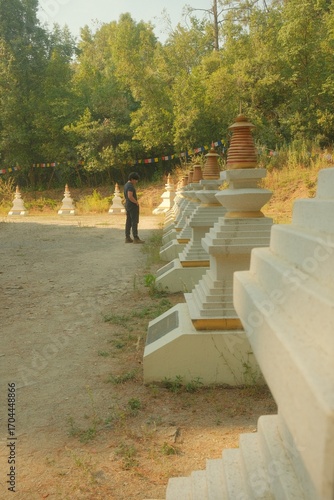 Buddhist Stupa with Prayer Flags and Golden Spire, Low-Angle View