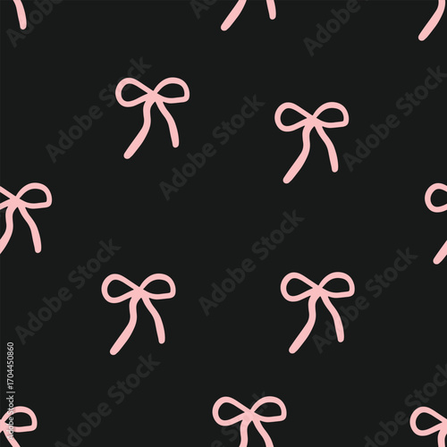 Seamless pattern with pink ribbon bows on a dark background